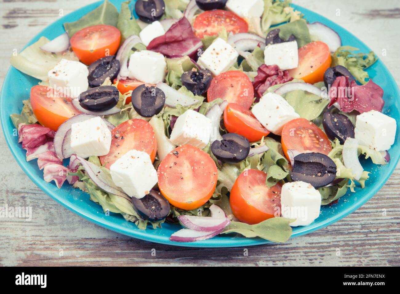 Fresh greek salad with feta cheese and vegetables as healthy meal