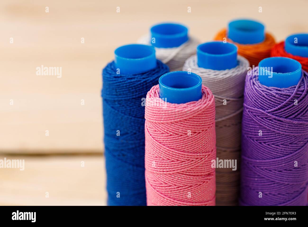 Close up of colored thread coils, thread spools background Stock Photo ...