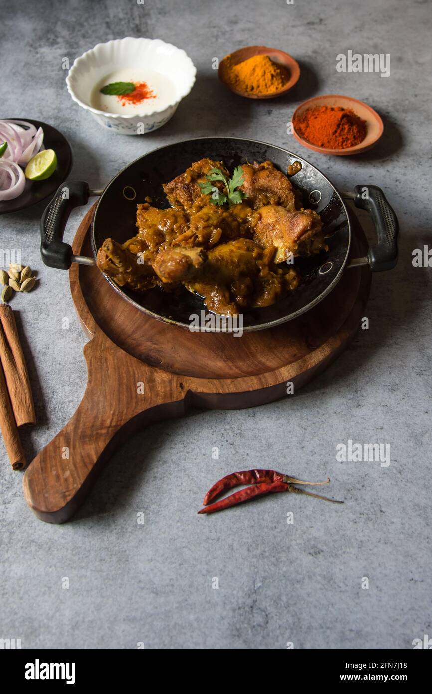 Chicken kasha or chicken cooked with Indian spices, onion and ginger garlic paste and yogurt. A spicy semi dry food item. Stock Photo