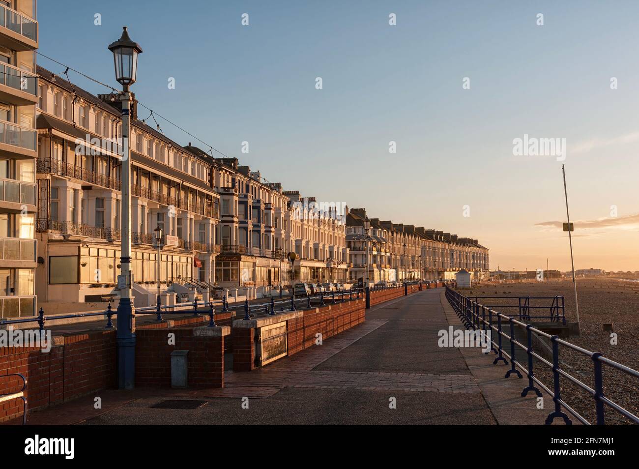EASTBOURNE, EAST SUSSEX, UK - APRIL 30, 2012:  Sunlit guest houses and hotels along Grand Parade Stock Photo