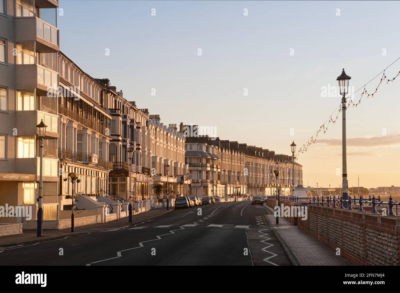 EASTBOURNE, EAST SUSSEX, UK - APRIL 30, 2012:  Sunlit guest houses and hotels along Grand Parade Stock Photo