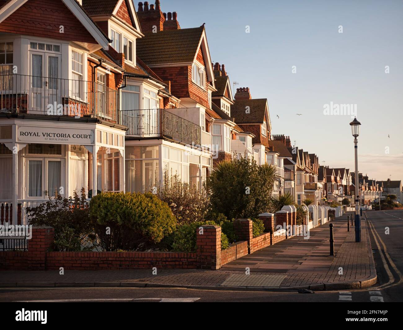 EASTBOURNE, EAST SUSSEX, UK - APRIL 30, 2012:    Sunlit guest houses and hotels along Grand Parade Stock Photo