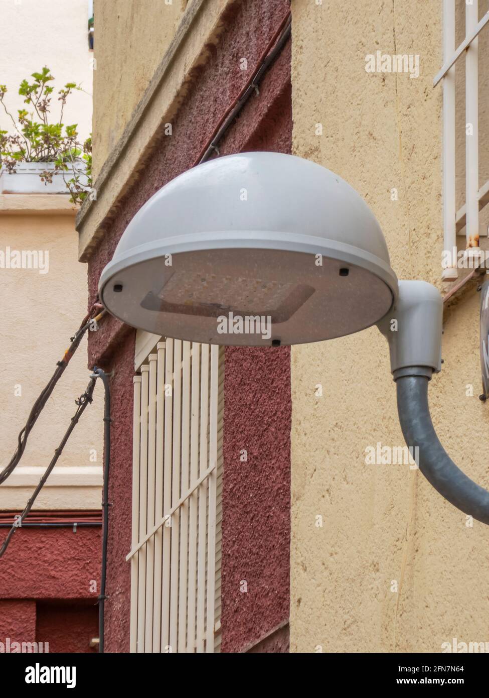 Modern led streetlight installed in an old style Spanish neighborhood