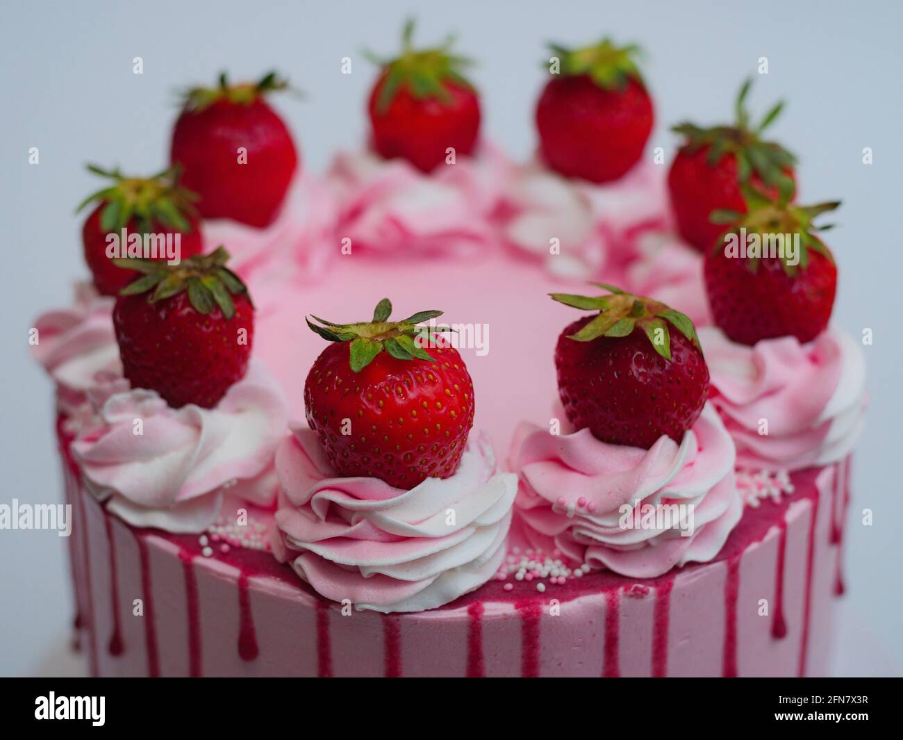 Pink cake with strawberries Stock Photo - Alamy