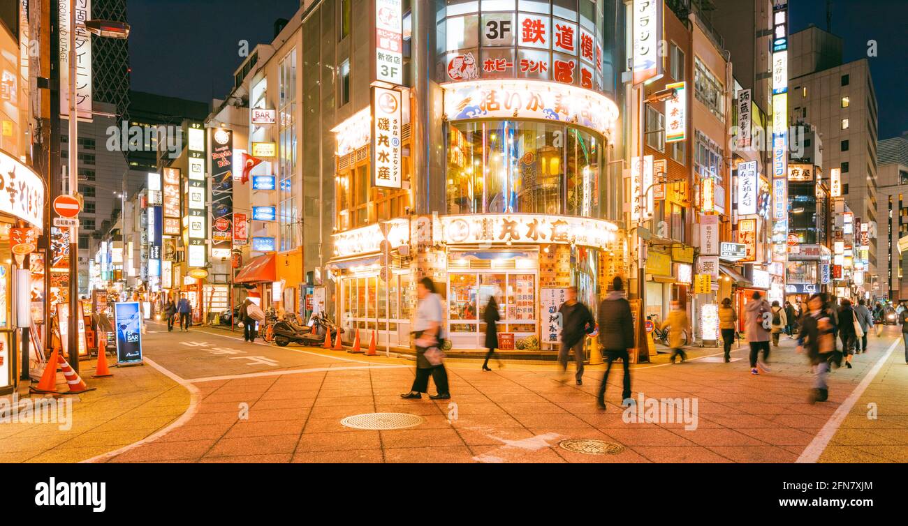 Tokyo, Japan - January 10, 2016:  Street view of Nishi Shinjuku Shopping street whith several Japanese Restaurants on the sides. Stock Photo