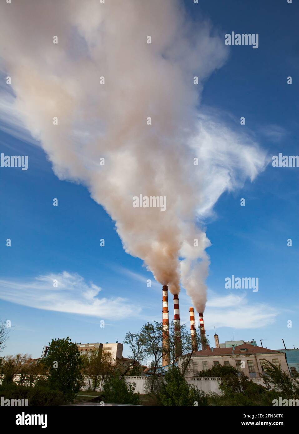 Pavlodar thermal electric station. Smoke stacks with white smoke Stock Photo