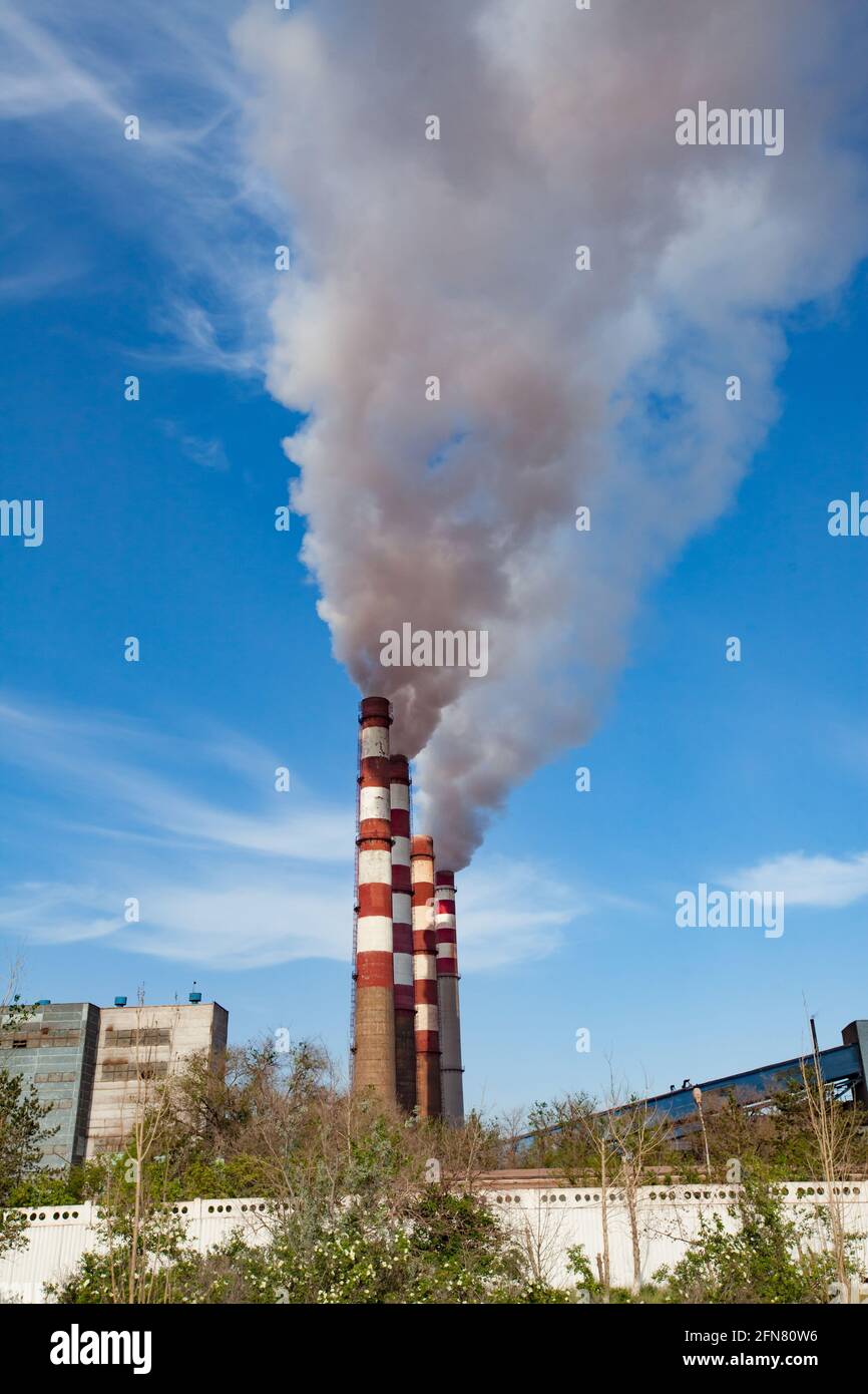 Pavlodar thermal electric station. Smoke stacks with white smoke Stock Photo