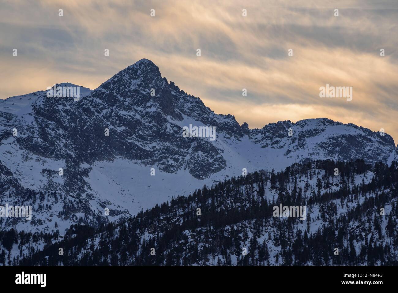 Montardo summit seen from the Guardader de Beret viewpoint, in a winter sunset (Aran Valley, Catalonia, Spain, Pyrenees) Stock Photo