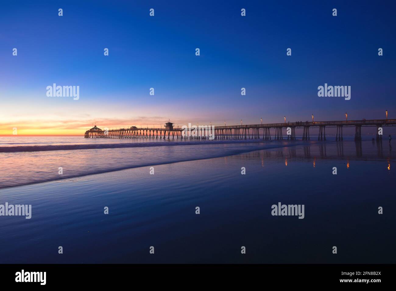 Blue hour sunset seascape with panoramic view of Imperial Beach Pier