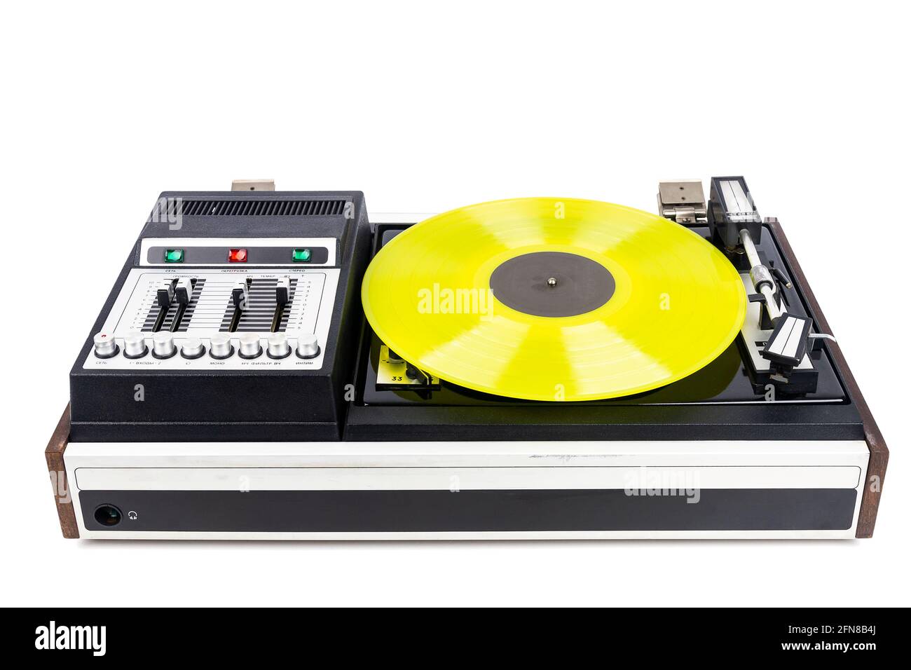 Vintage turntable vinyl record player with yellow vinyl isolated on ...