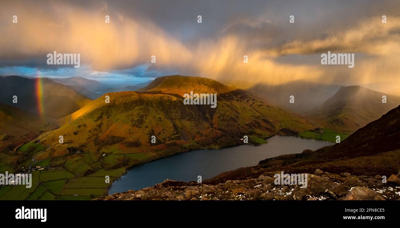 A brief heavy shower passes over Buttermere, Robinson, Dale Head & Fleetwith Pike in the Lake District, UK Stock Photo