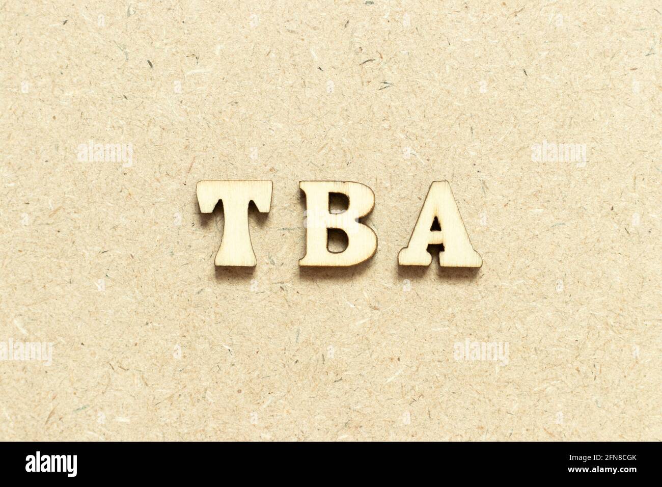 Alphabet letter in word TBA (abbreviation of to be announced) on wood  background Stock Photo - Alamy