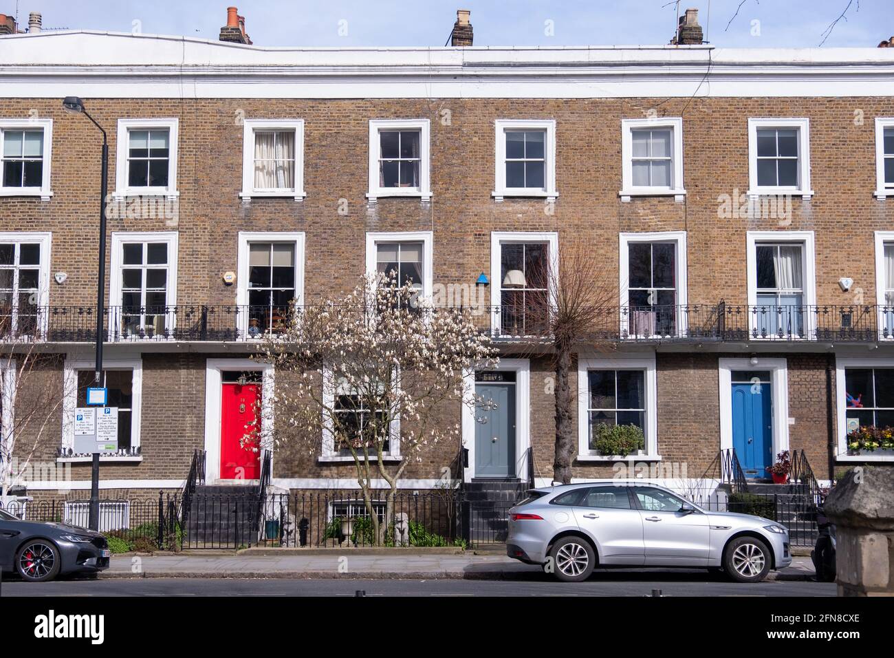 London- May 2021: Residential street of west London townhouses Stock Photo