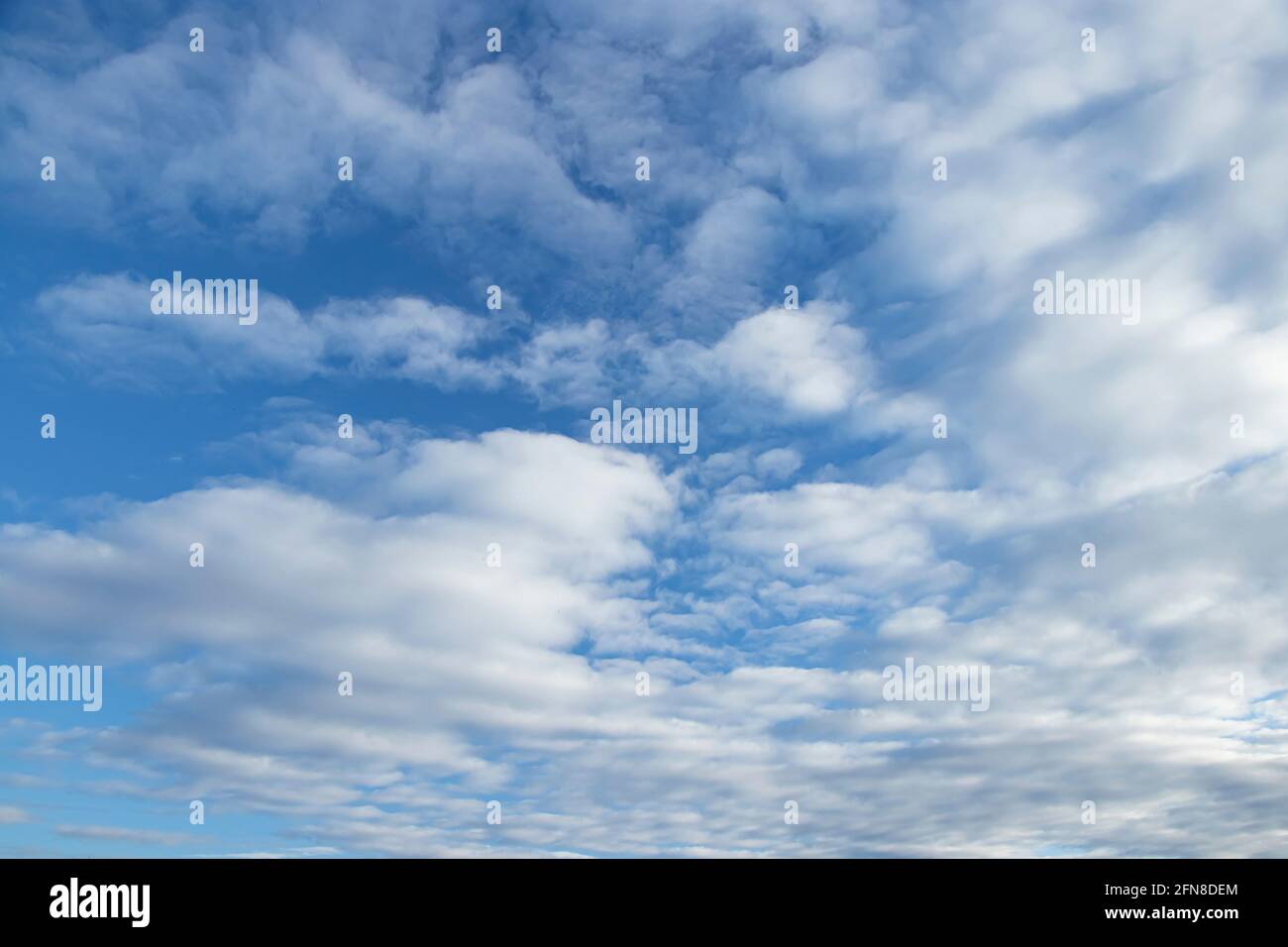 Spindrift clouds. Blue sky with white clouds. Stock Photo