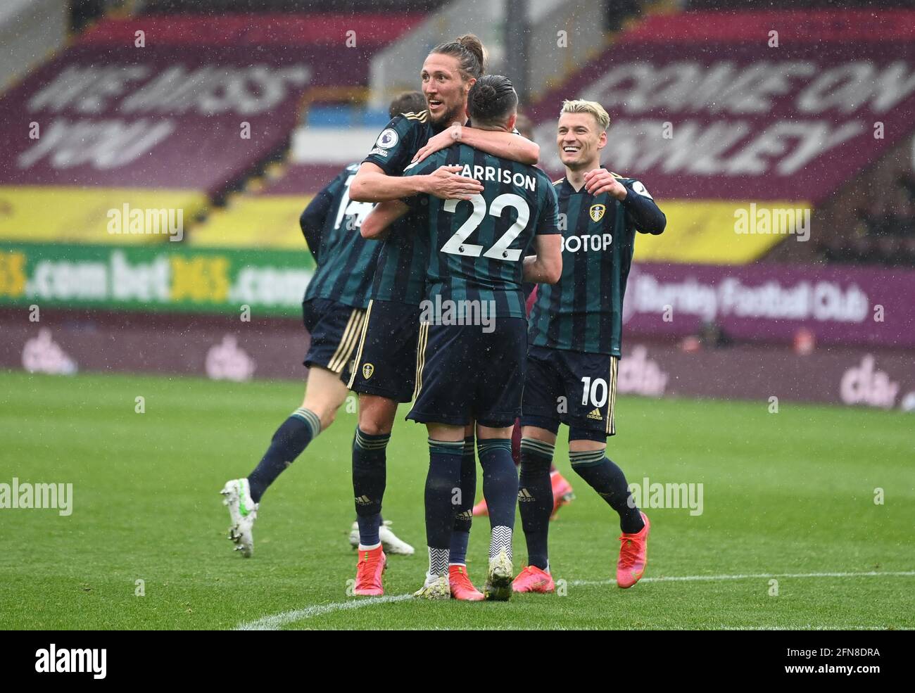 Leeds United players celebrate after Jack Harrison scores their side's second goal of the game during the Premier League match at Turf Moor, Burnley. Picture date: Saturday May 15, 2021. Stock Photo