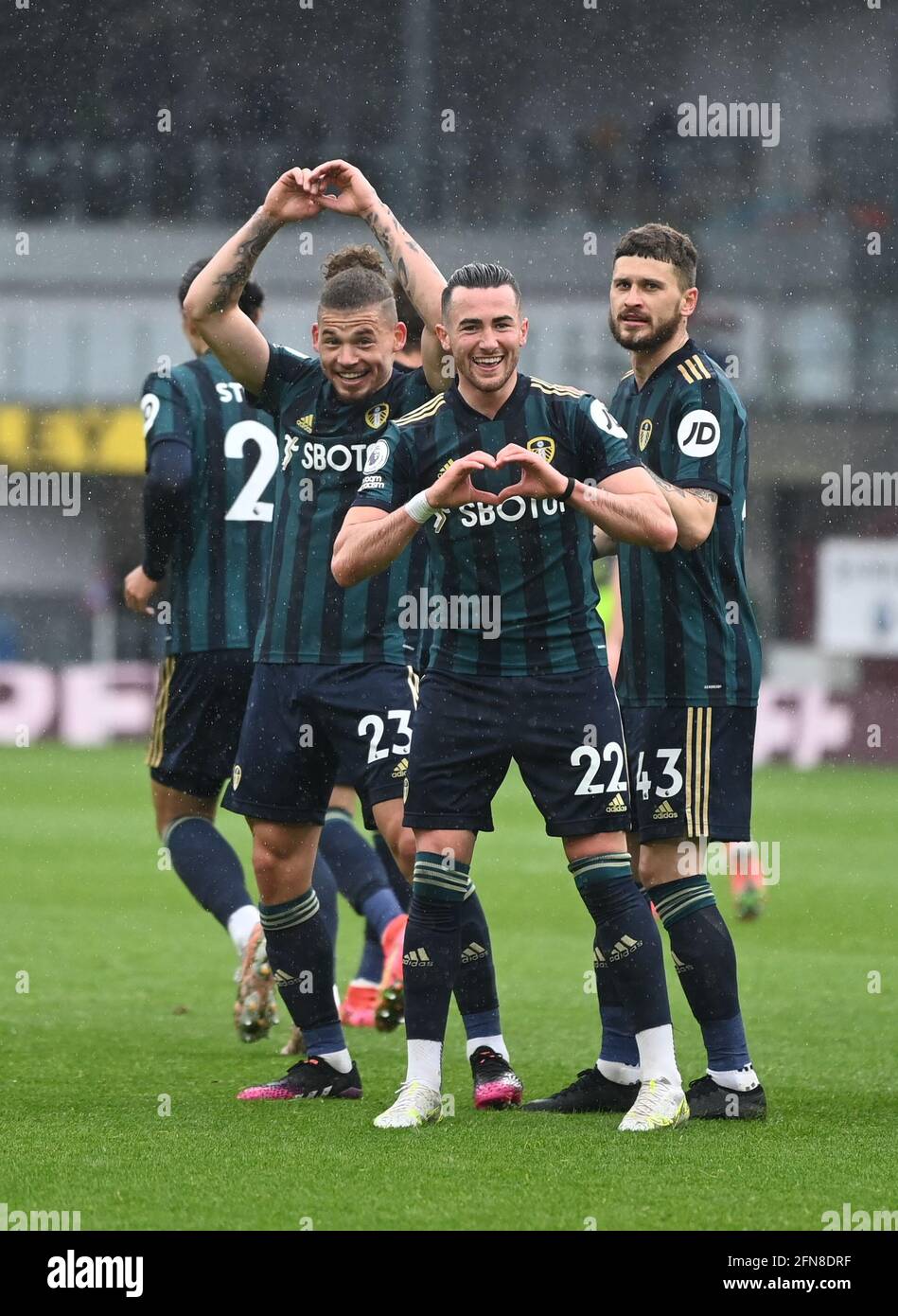 Leeds United players celebrate after Jack Harrison scores their side's second goal of the game during the Premier League match at Turf Moor, Burnley. Picture date: Saturday May 15, 2021. Stock Photo