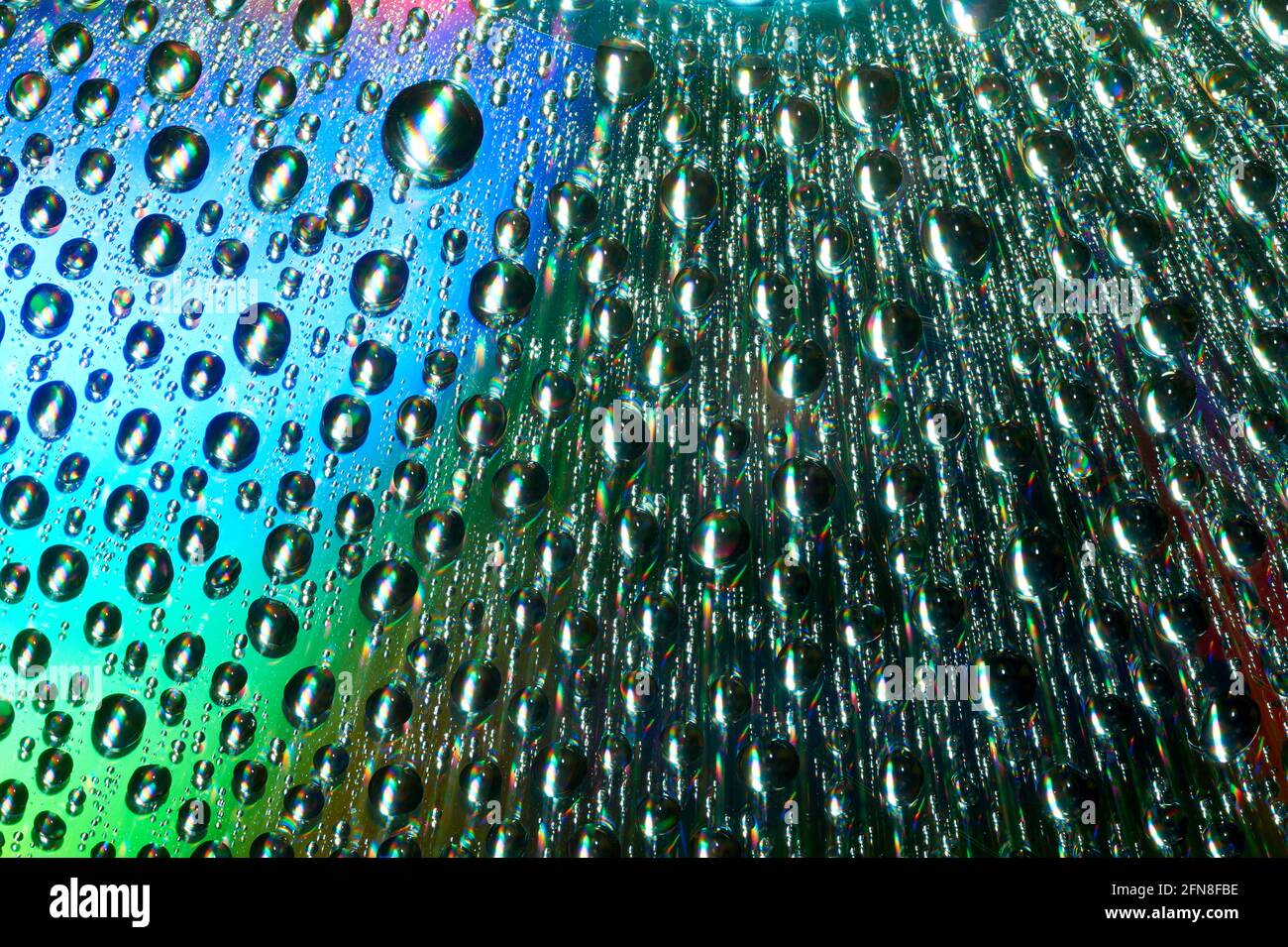 Macro of water drops on multicolor background Stock Photo - Alamy