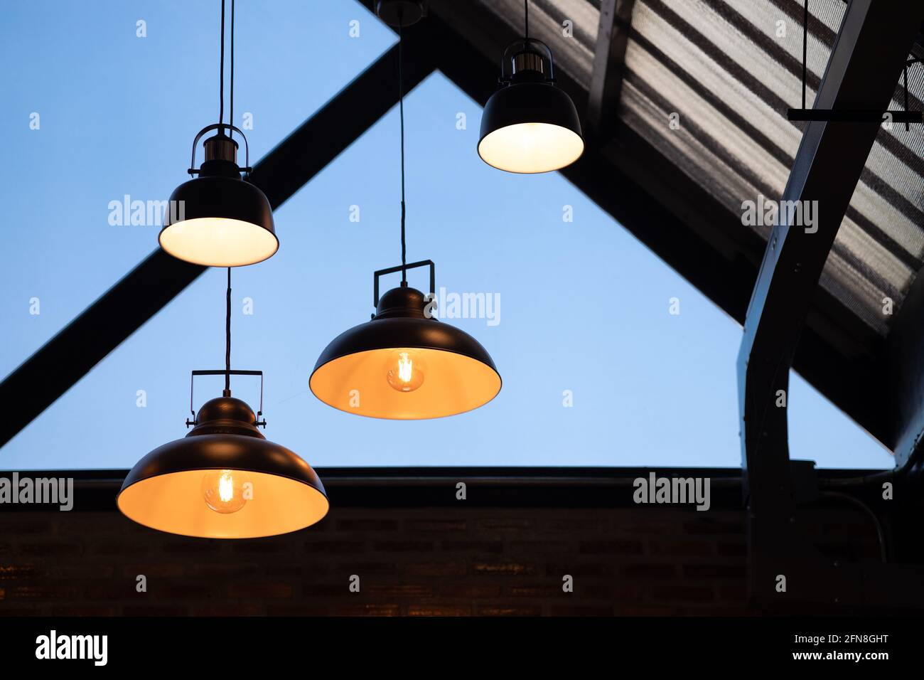 Interior lighting decoration loft home roof hanging light bulb retro vintage industrial style. Stock Photo