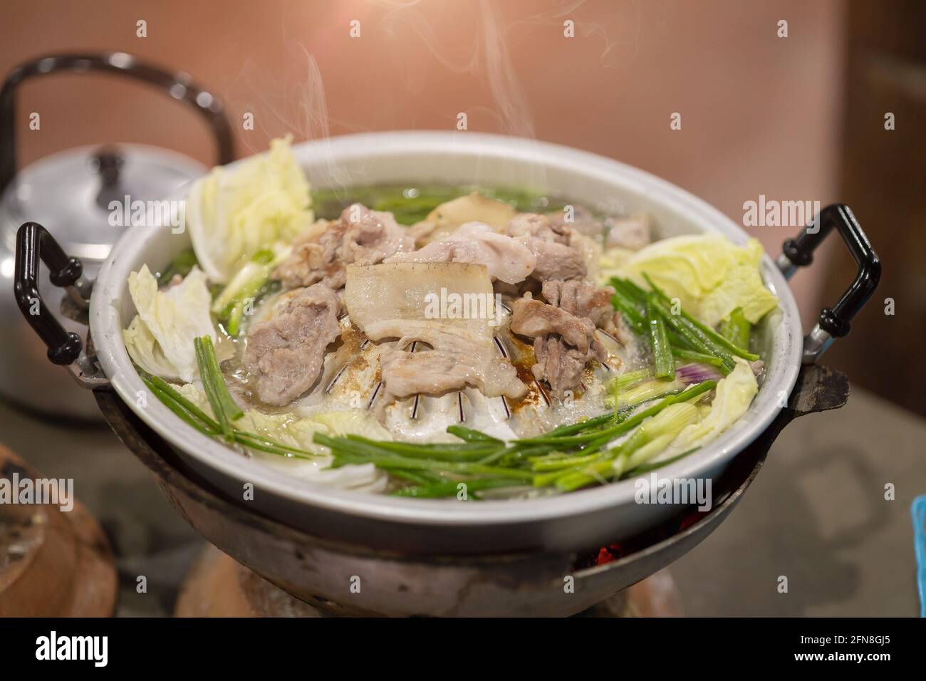 Thai style pork pan BBQ grill with vegetable soup called Moo-Ka-Ta. Stock Photo