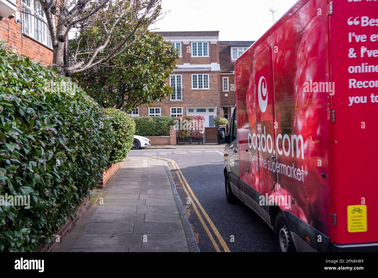 London- August, 2021: Ocado delivery truck on residential street in London- a leading British online supermarket Stock Photo
