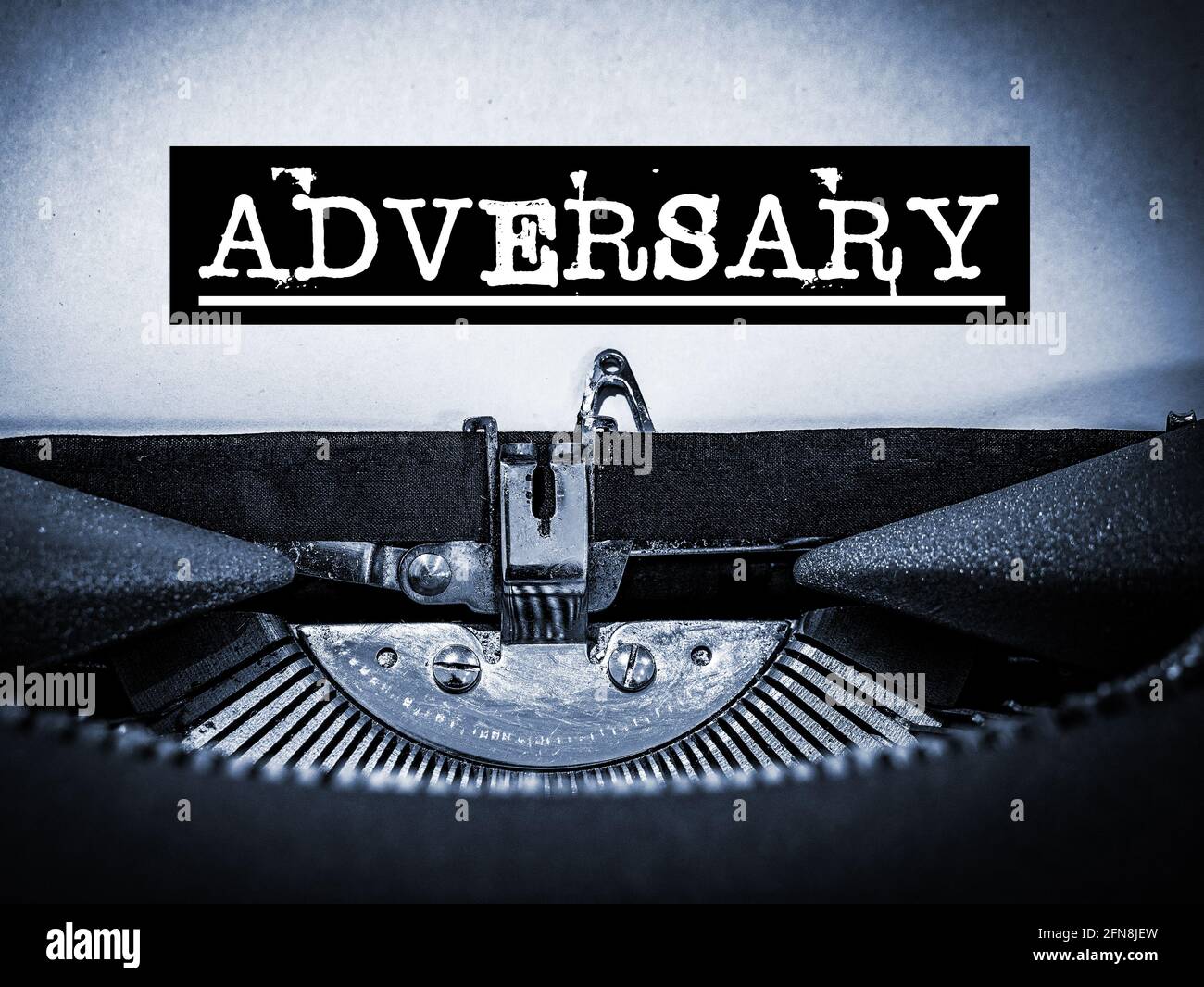 Adversary displayed on a vintage typewriter with underline script and black border Stock Photo