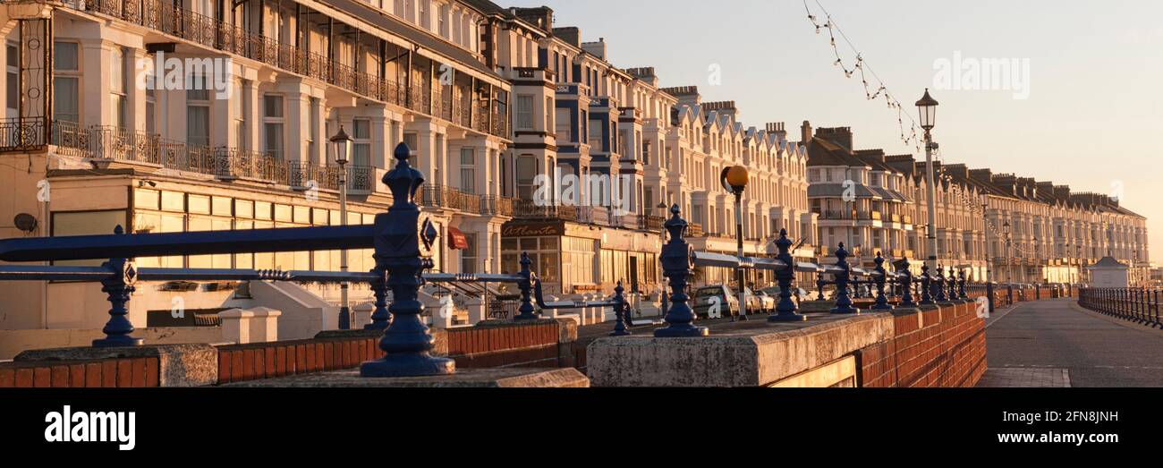 EASTBOURNE, EAST SUSSEX, UK - APRIL 30, 2012:  Panorama view along Grand Parade with sunlit guest houses and hotels Stock Photo