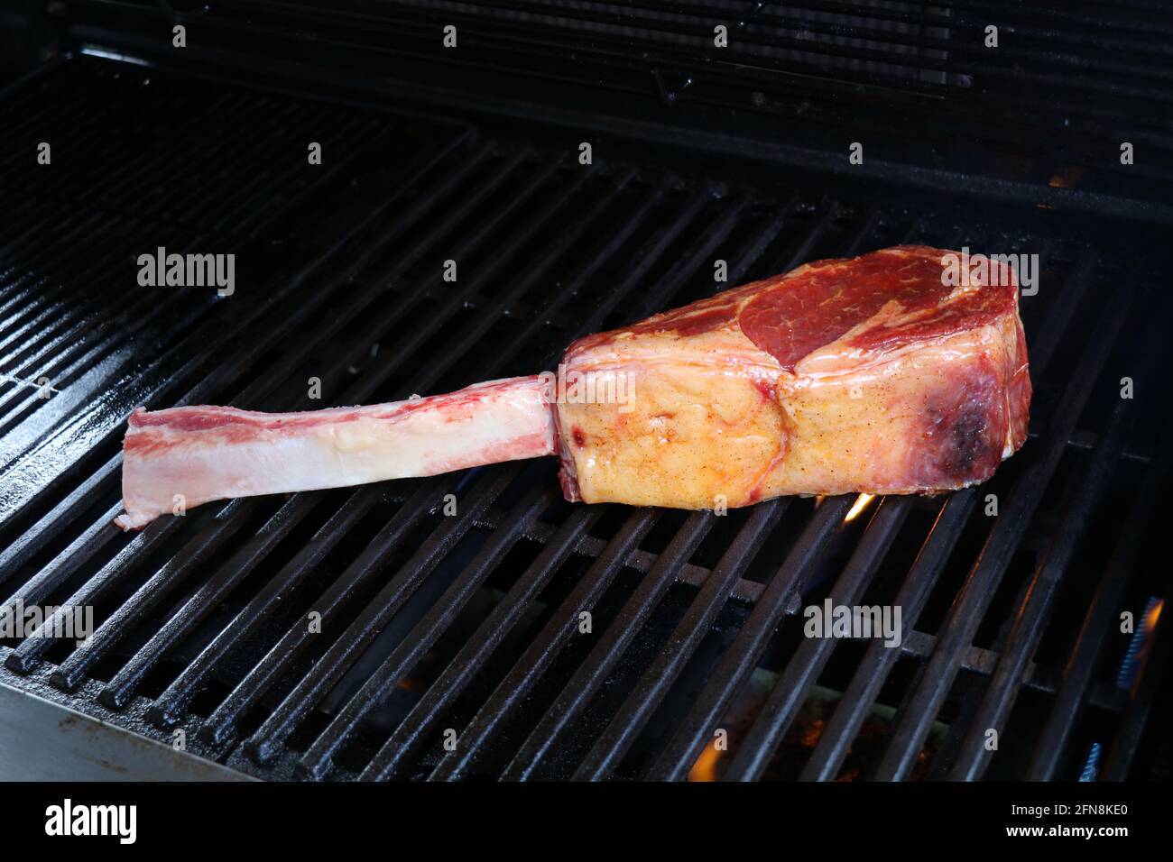 tomahawk steak on the grill Stock Photo