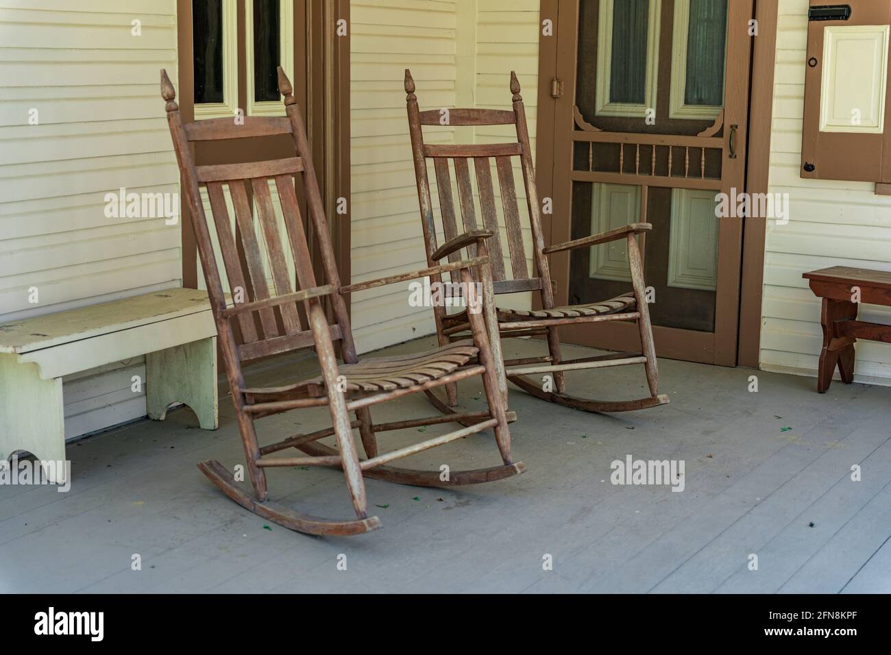 A pair of rocking chairs on a country porch. Stock Photo