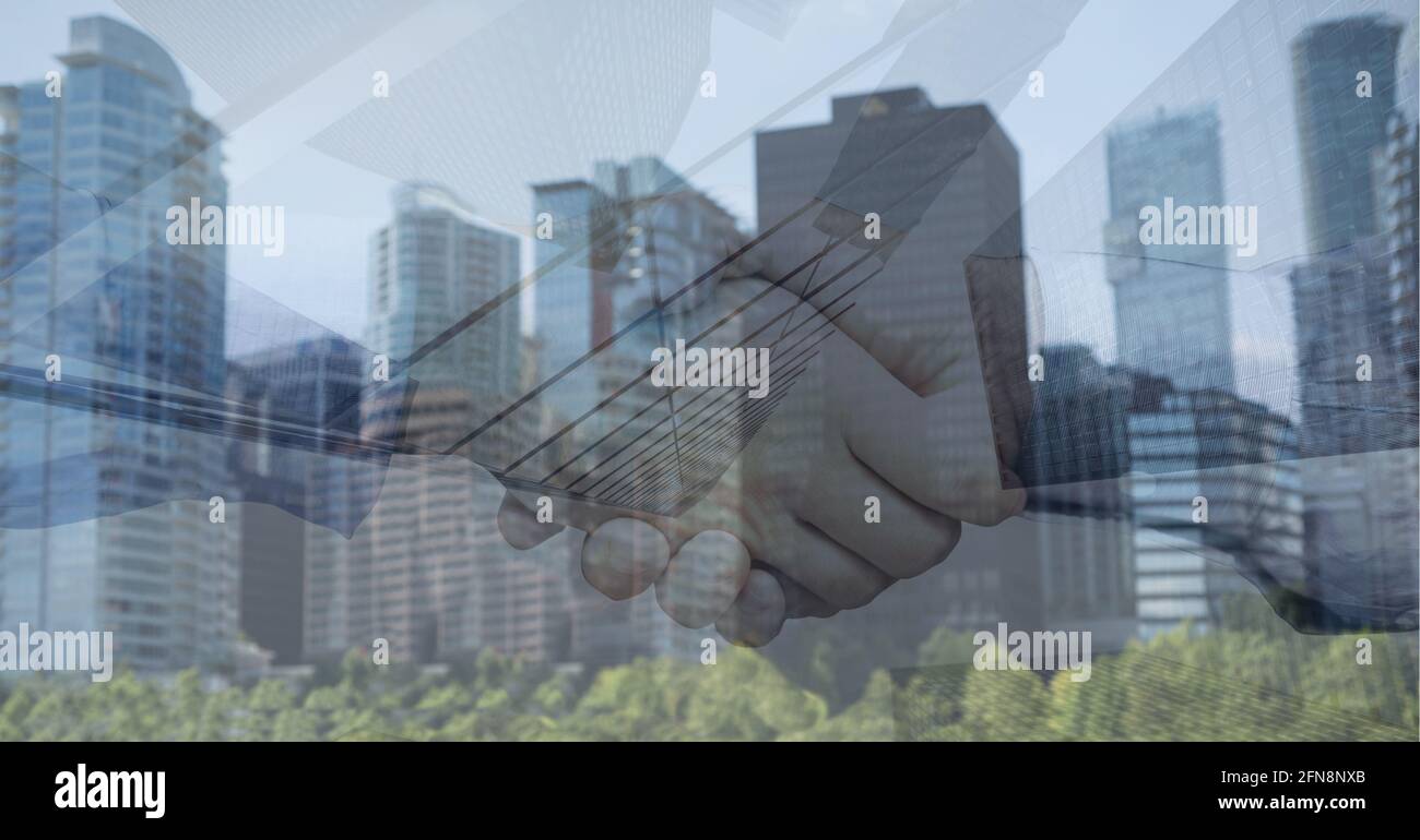 Animation of businessmen shaking hands over cityscape Stock Photo - Alamy