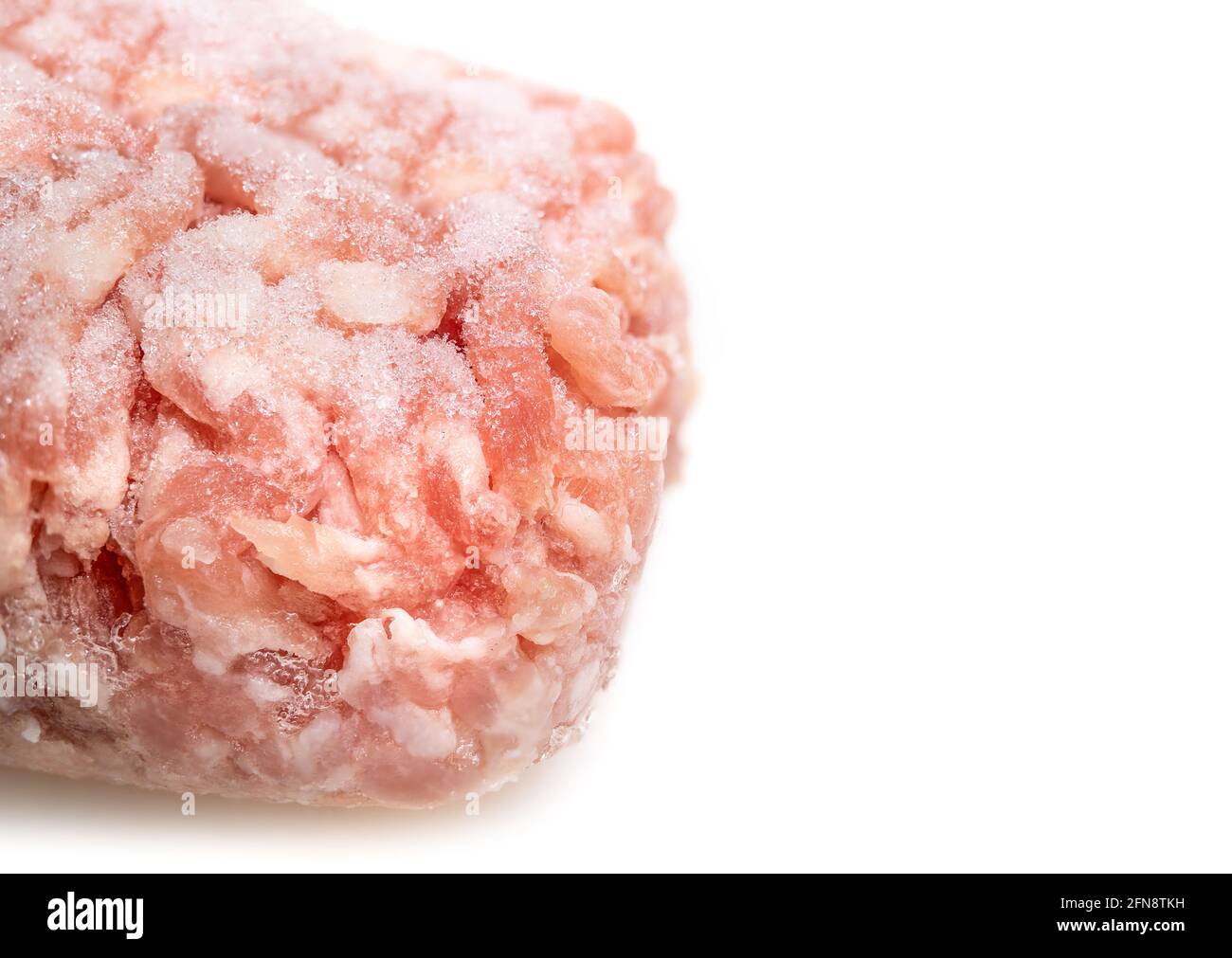 Frozen medium ground pork. Small portioned out ground lean pork meat for a single serving meal. Concept for budget wise cooking, buying and storing la Stock Photo