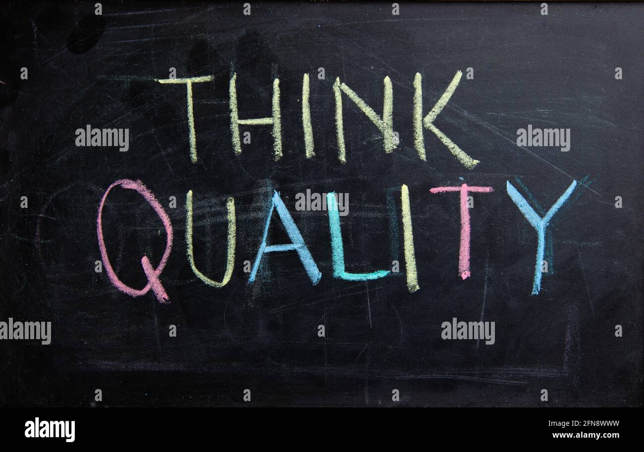 Handwriting text writing Think Quality on blackboard. Concept meaning always think of Quality Stock Photo