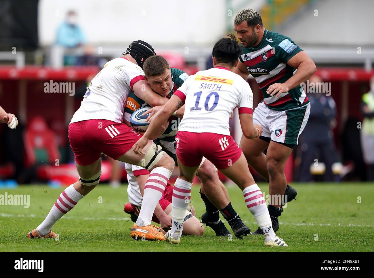 Leicester Tigers' Jasper Wiese (centre) is tackled by Harlequins' Matt Symons (left) and Marcus Smith during the Gallagher Premiership match at Mattioli Woods Welford Road, Leicester. Picture date: Saturday May 15, 2021. Stock Photo