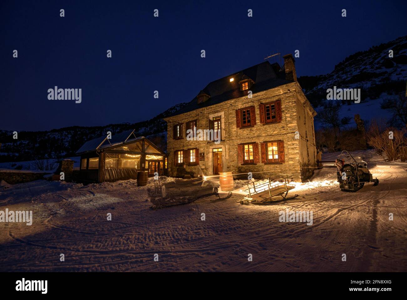 Montgarri hut and church at night in winter (Aran Valley, Catalonia, Pyrenees, Spain) ESP: Refugio y Santuario de Montgarri, una noche de invierno Stock Photo