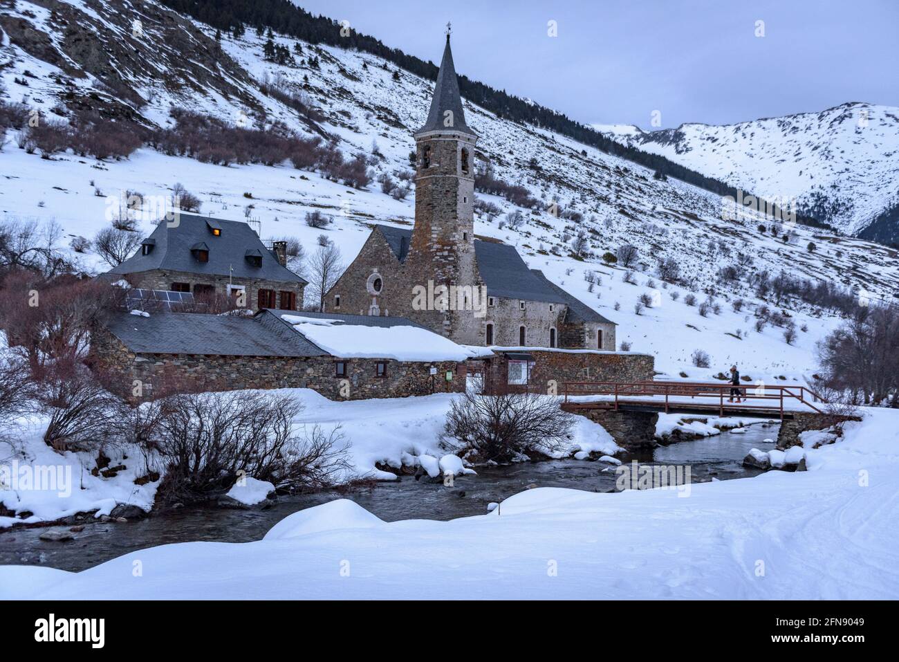 Montgarri hut and church in a winter twilight (Aran Valley, Catalonia, Pyrenees, Spain) ESP: Refugio y Santuario de Montgarri, un atardecer invernal Stock Photo