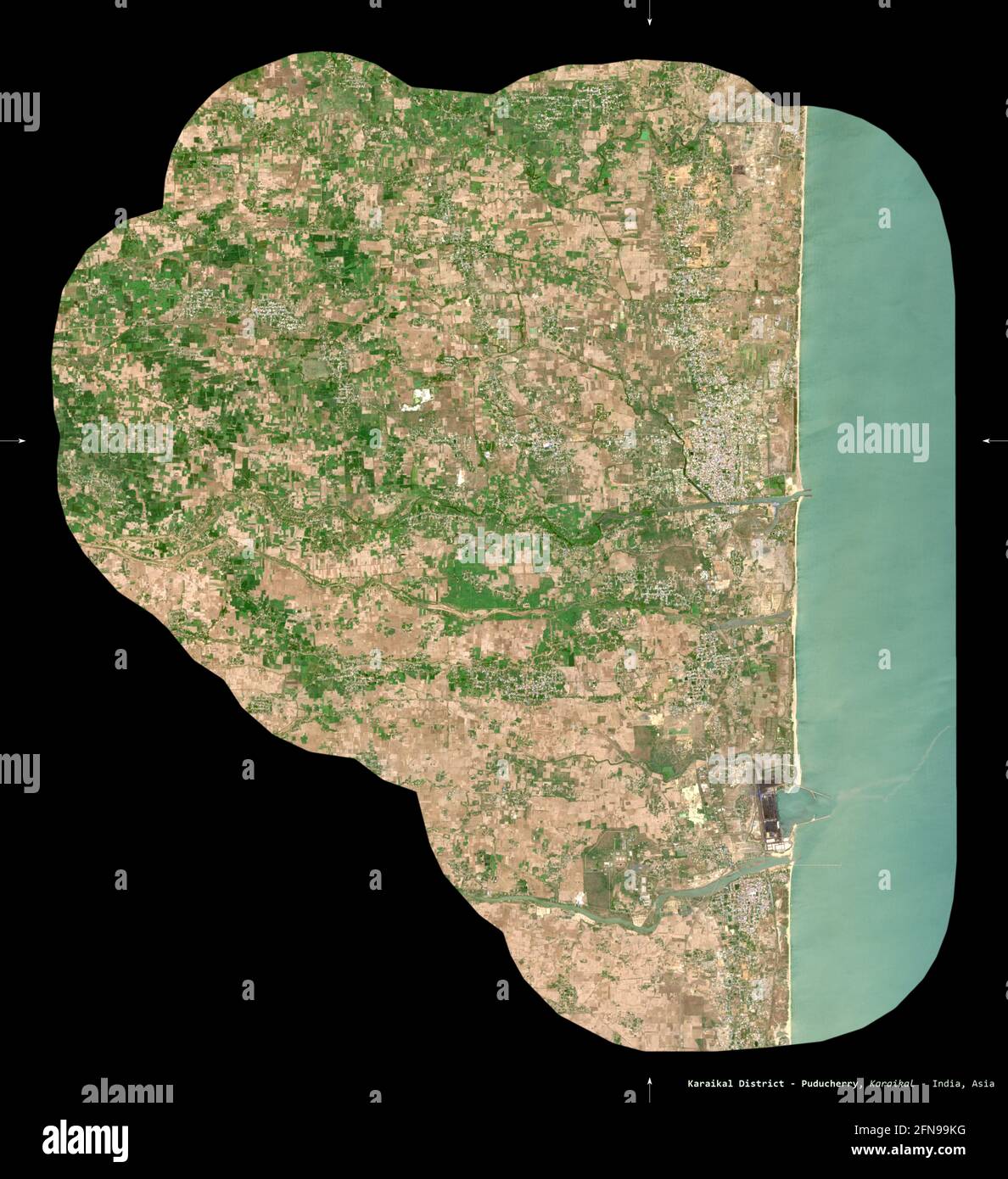 Karaikal District - Puducherry, district of the union territory of India. Sentinel-2 satellite imagery. Shape isolated on black. Description, location Stock Photo