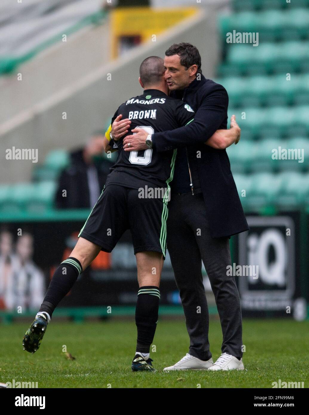 Scottish Premiership - Hibernian v Celtic. Easter Road Stadium, Edinburgh, Midlothian, UK. 15th May, 2021. Hibs play host to Celtic in the Scottish Premier League at Easter road, Edinburgh. Pic shows: HibsÕ Manager, Jack Ross, gives Celtic midfielder, Scott Brown, a sporting hug as he leaves the field after playing his last game for the Parkhead side. Credit: Ian Jacobs/Alamy Live News Stock Photo
