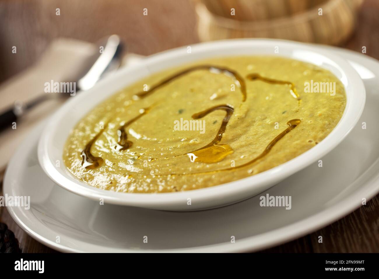 Season Soup with asparagus and vegetables on a plate. Stock Photo