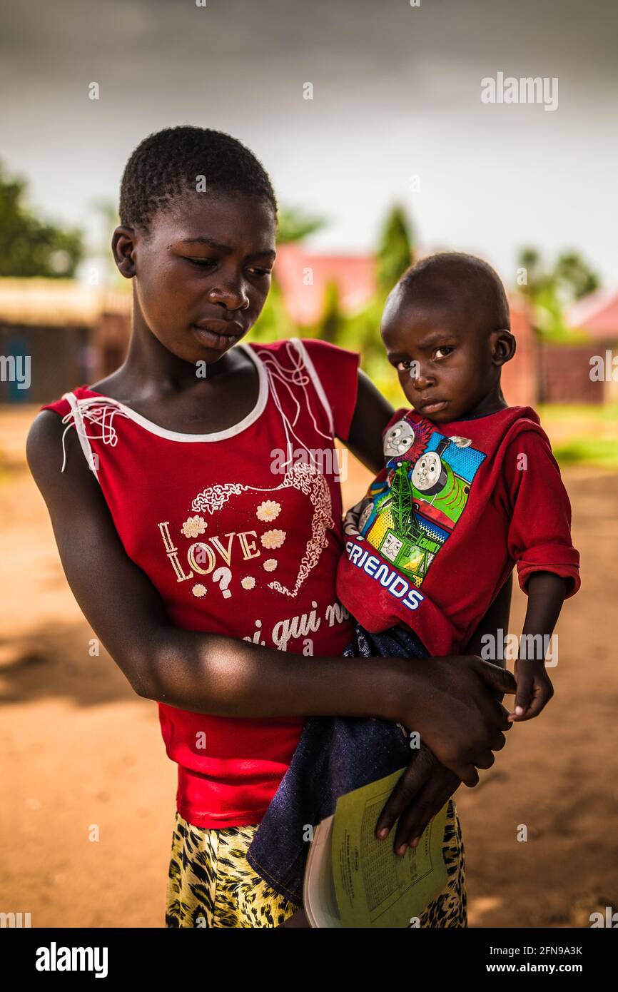 Portrait of a young mother with her son from rural Uganda Stock Photo