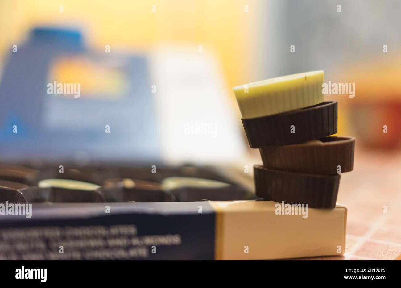Chocolate candies in a box, hazelnut almond and cashew nuts in choco