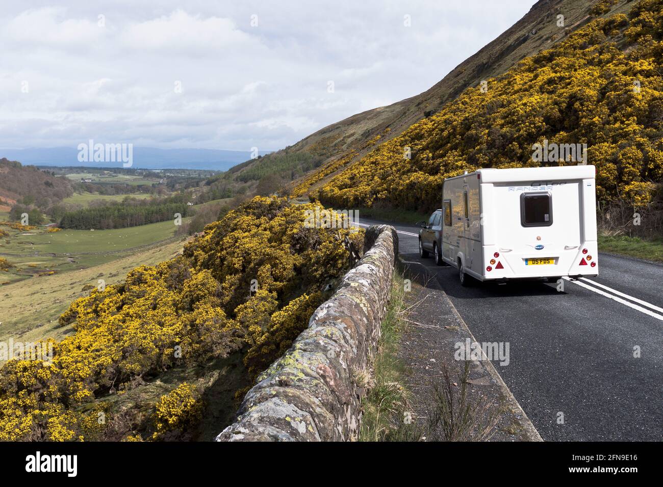 dh  GLEN EAGLES PERTHSHIRE Scottish caravan rear view road travel glens countryside Scotland rural tourist roads country scene uk A823 towing holiday Stock Photo