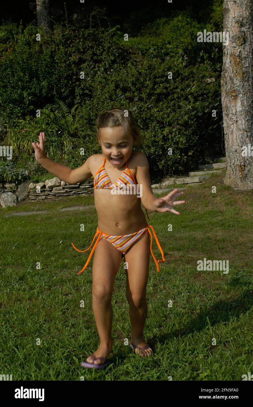 Baby girl is playing, bikini, water, summer, italian girl Stock Photo -  Alamy