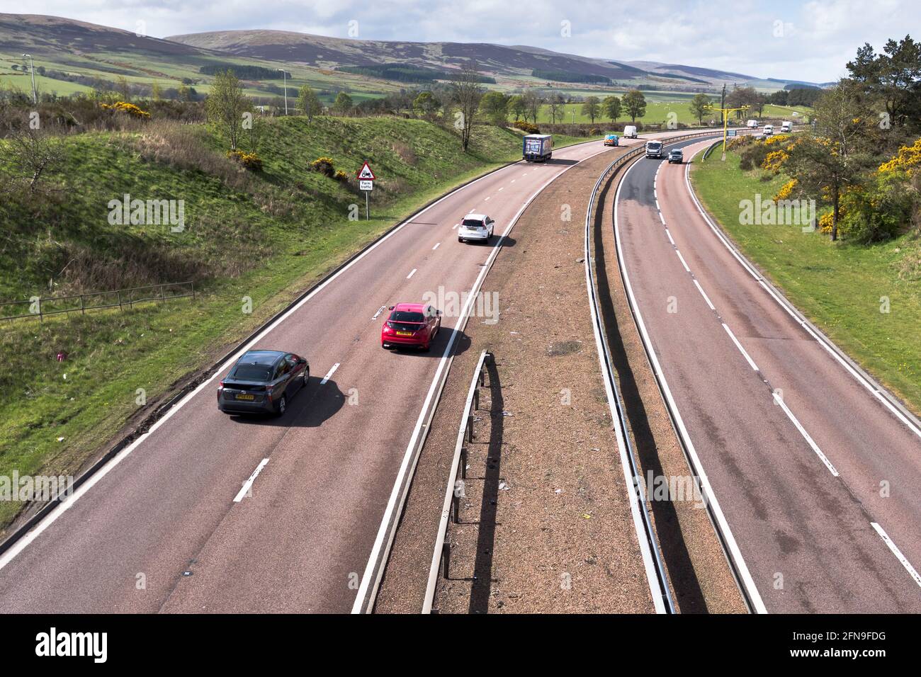 dh  A9 PERTHSHIRE Scottish road dual carriageway scotland country car traffic uk Stock Photo