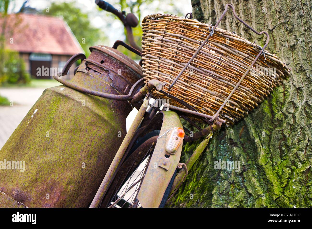 Old rusty bike / Altes,rostiges Fahrrad mit Milchkanne Stock Photo