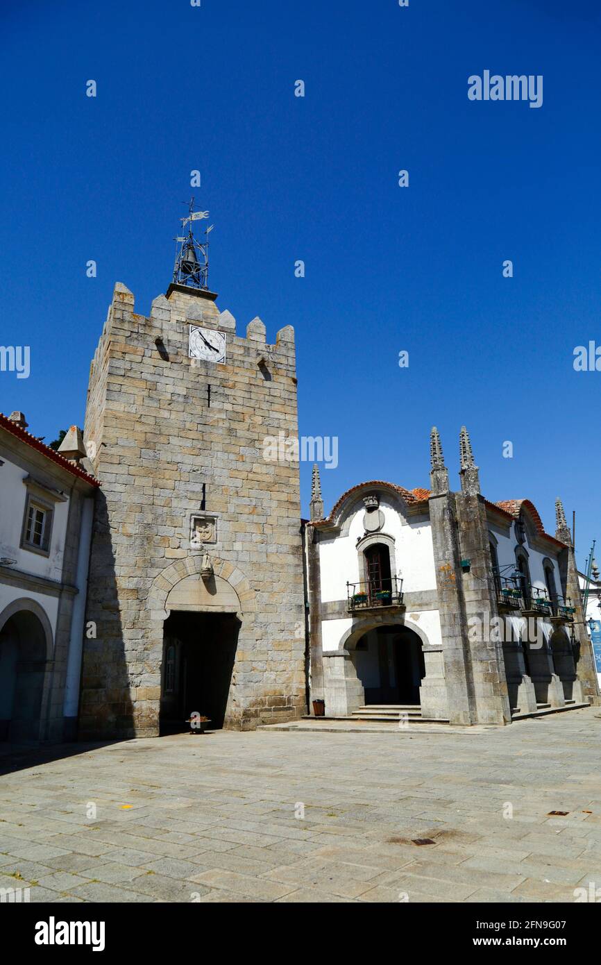 Clock Tower / Torre do Relógio, formerly the main tower of the castle, Old Town Hall on the right, Caminha, Minho Province, Portugal Stock Photo