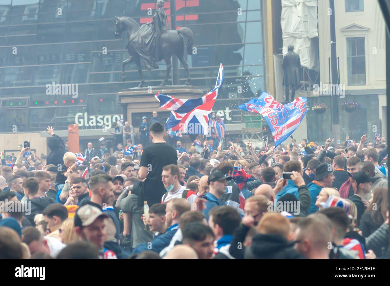 Glasgow, Scotland, UK. 15th May, 2021. Rangers fans celebrate  winning the Scottish Premiership title. Credit: Skully/Alamy Live News Stock Photo