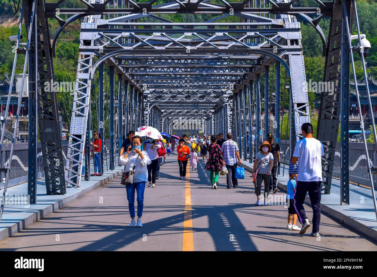 The Zhongshan Bridge in Lanzhou (China) during a sunny afternoon,China first metal bridge along the yellow river Stock Photo