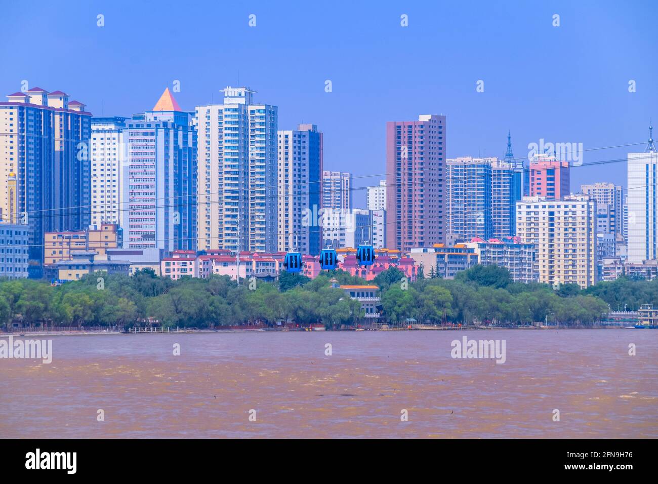 Lanzhou City on the other side of the Yellow River, Gansu Province, China Stock Photo