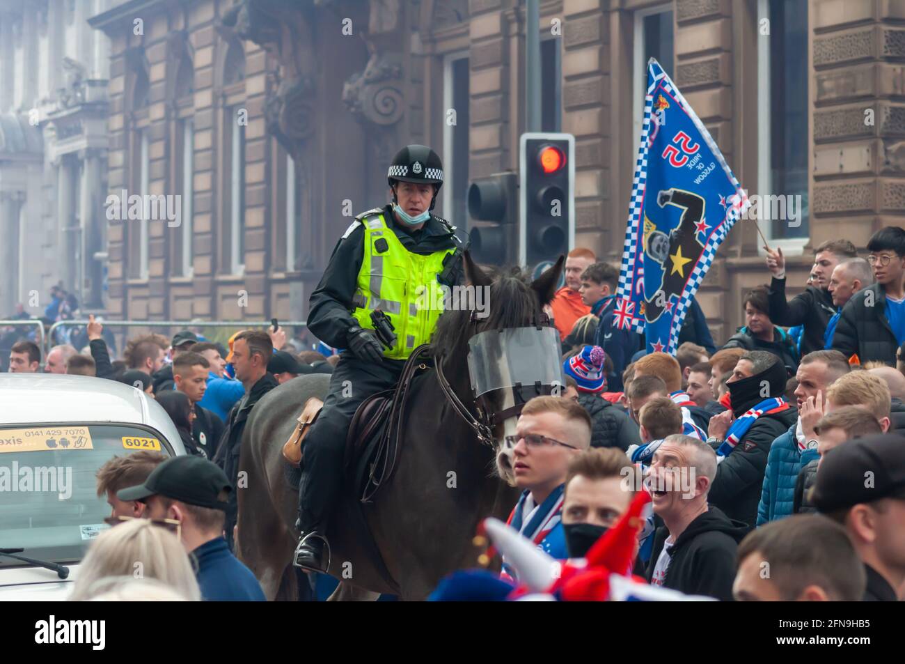 Glasgow, Scotland, UK. 15th May, 2021. Rangers fans celebrate  winning the Scottish Premiership title. Credit: Skully/Alamy Live News Stock Photo