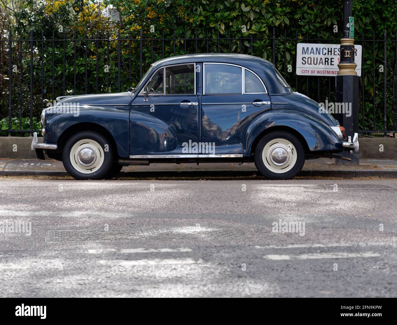 London, Greater London, England - May 11 2021:  Cute vintage car parked at Manchester Square. Stock Photo