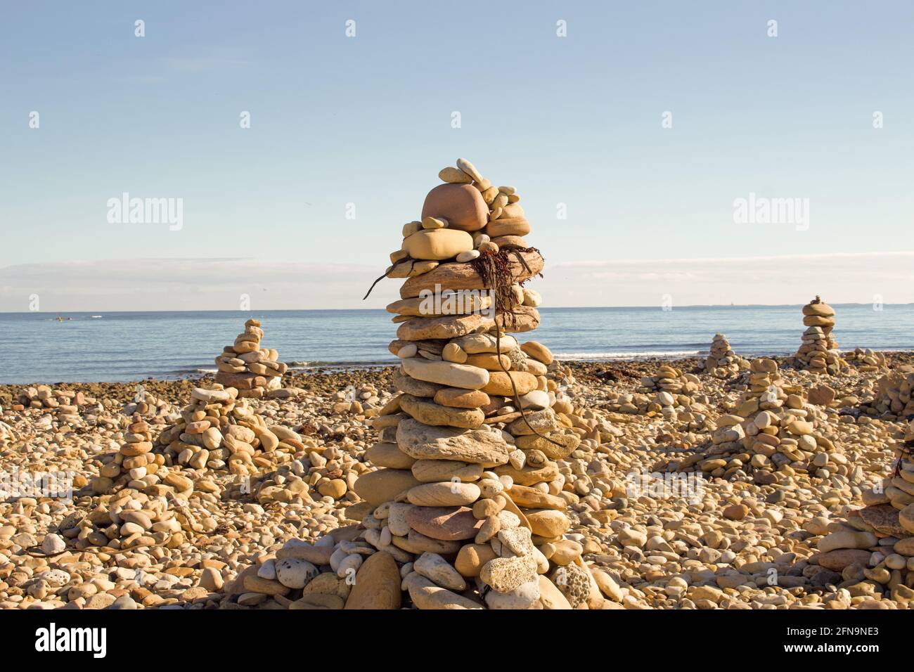 Rocks stacked up high on the beach Stock Photo Alamy